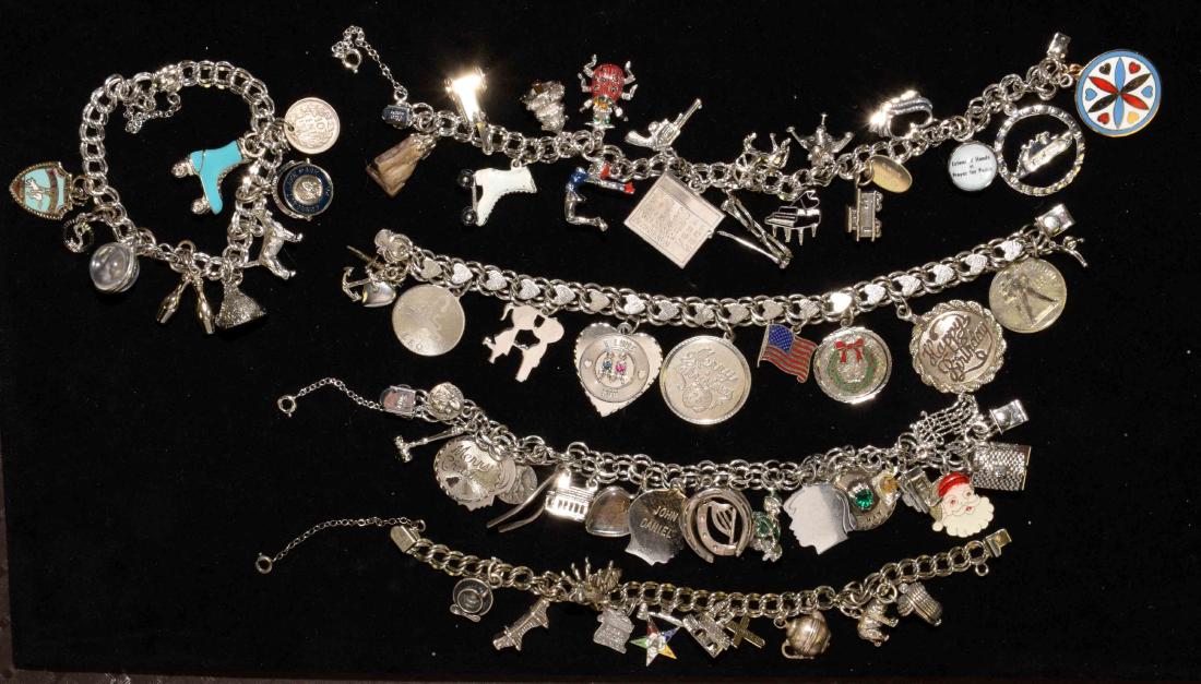 (5) ASST. VINTAGE STERLING ELCO DOUBLE LINK CHARM: (5) ASST. VINTAGE STERLING ELCO DOUBLE LINK CHARM BRACELETS w/slide safety clasps. Includes over (60) antique charms in sterling or white metal. Total weight: 7.4 ozt.