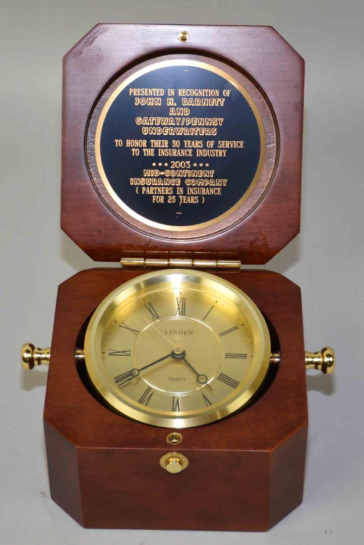 LINDEN QUART CLOCK IN WOODEN CASE. 3.5''H x 5.5''W x: LINDEN QUART CLOCK IN WOODEN CASE. 3.5''H x 5.5''W x 5.5''D.