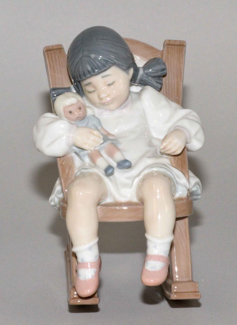 LLADRO ''NAPTIME'' 1986 PORCELAIN GIRL ASLEEP IN ROCKER: LLADRO ''NAPTIME'' 1986 PORCELAIN GIRL ASLEEP IN ROCKER FIGURINE. #5448. Excellent condition w/box. Blue stamp, height 4.75''.