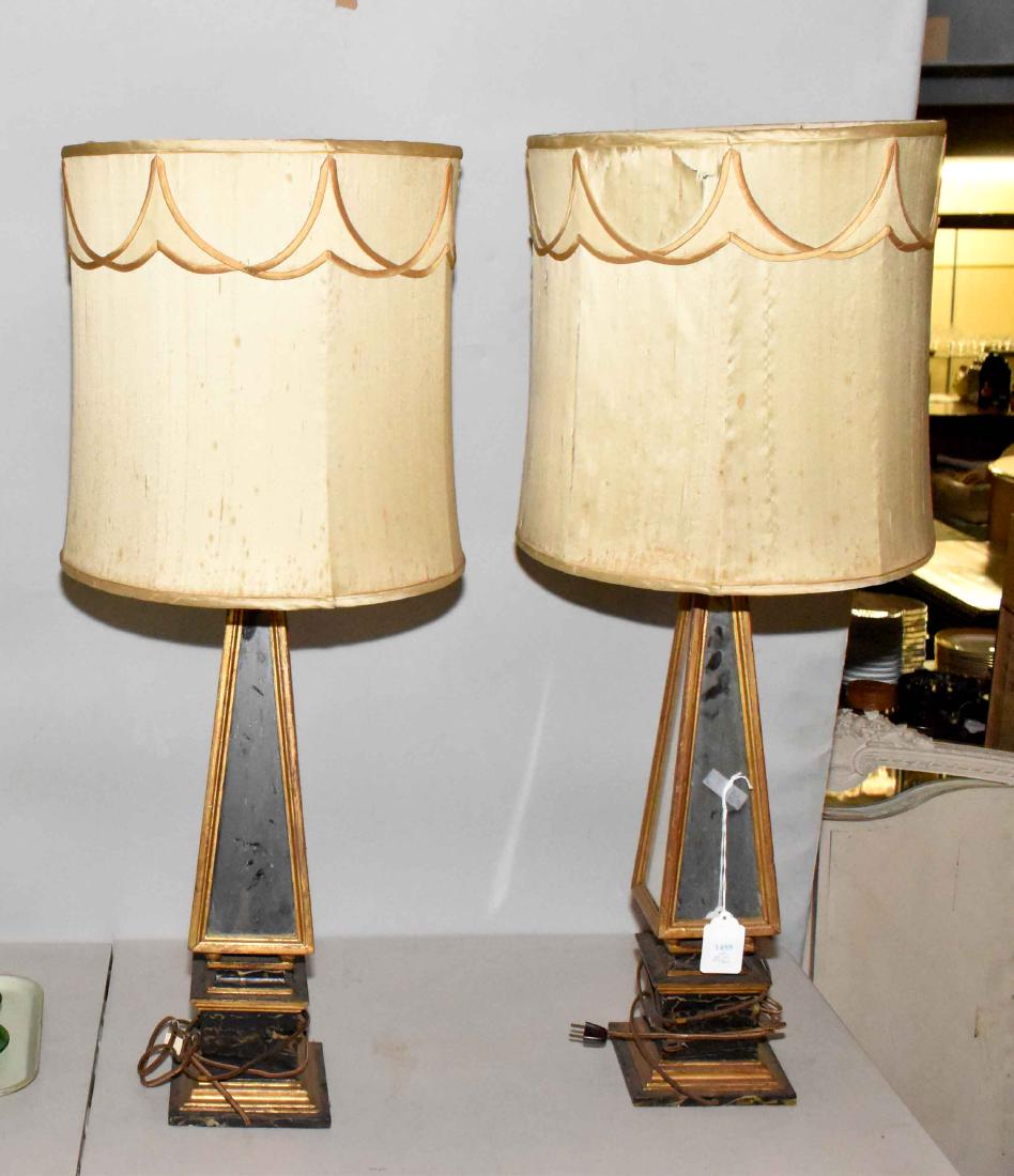 A PAIR OF HOLLYWOOD REGENCY MIRRORED AND PORTOR MARBLE: A PAIR OF HOLLYWOOD REGENCY MIRRORED AND PORTOR MARBLE LARGE TABLE LAMPS. Circa 1950's. Each of square section, the stepped portor marble base with a tapering mirrored standard, fitted with draped sil
