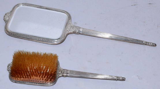 INTERNATIONAL STERLING MIRROR AND BRUSH SET. Largest:: INTERNATIONAL STERLING MIRROR AND BRUSH SET. Largest: 16'' long.