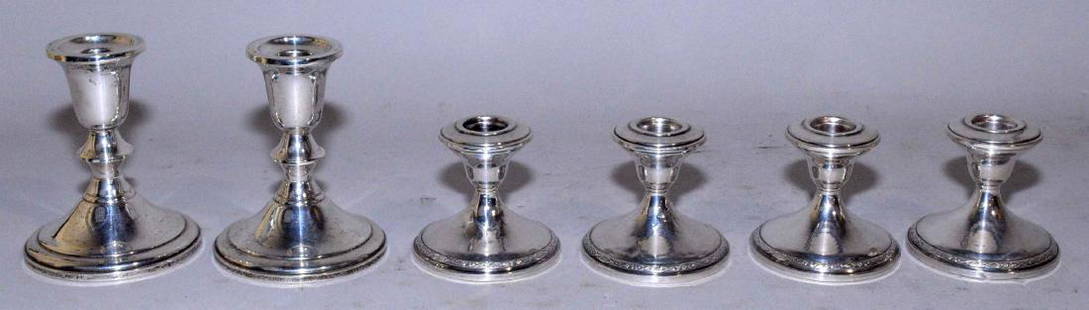 THREE PAIRS OF WEIGHTED STERLING CANDLESTICKS. Largest:: THREE PAIRS OF WEIGHTED STERLING CANDLESTICKS. Largest: 4.25''H.