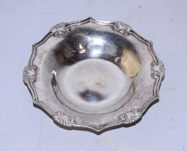 A SHAPED CIRCULAR SMALL DISH, MARK OF TIFFANY & CO. New: A SHAPED CIRCULAR SMALL DISH, MARK OF TIFFANY & CO. New York, 1907-1947, with applied shell and reeded rim. 2.3 ozt.