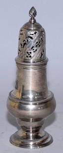 A GEORGE II STERLING CASTER, with mark of John: A GEORGE II STERLING CASTER, with mark of John Delmestre, London, 1758, of typical baluster-form engraved with a stag-form armorial crest. 6 1/2 in. high; 2 1/2 in. diameter.