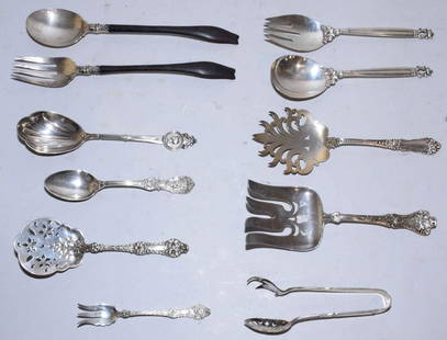 A GROUP OF ELEVEN VARIOUS STERLING AND SILVER-MOUNTED: A GROUP OF ELEVEN VARIOUS STERLING AND SILVER-MOUNTED UTENSILS. Marks of various makers, 20th Century. Including: a pair of salad servers, maker's mark of 'Georg Jensen Siliversmithy', post-1945, in