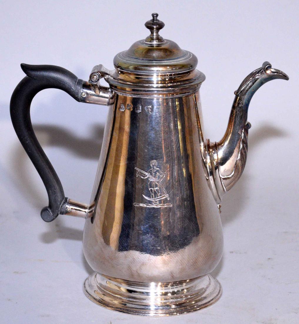 A GEORGE II STERLING INDIVIDUAL COFFEE POT. Mark for: A GEORGE II STERLING INDIVIDUAL COFFEE POT. Mark for Richard Bayley, London, 1741. Of tapering cylindrical form, with husk-mounted scroll spigot and carved wood handle, the body engraved with a figura