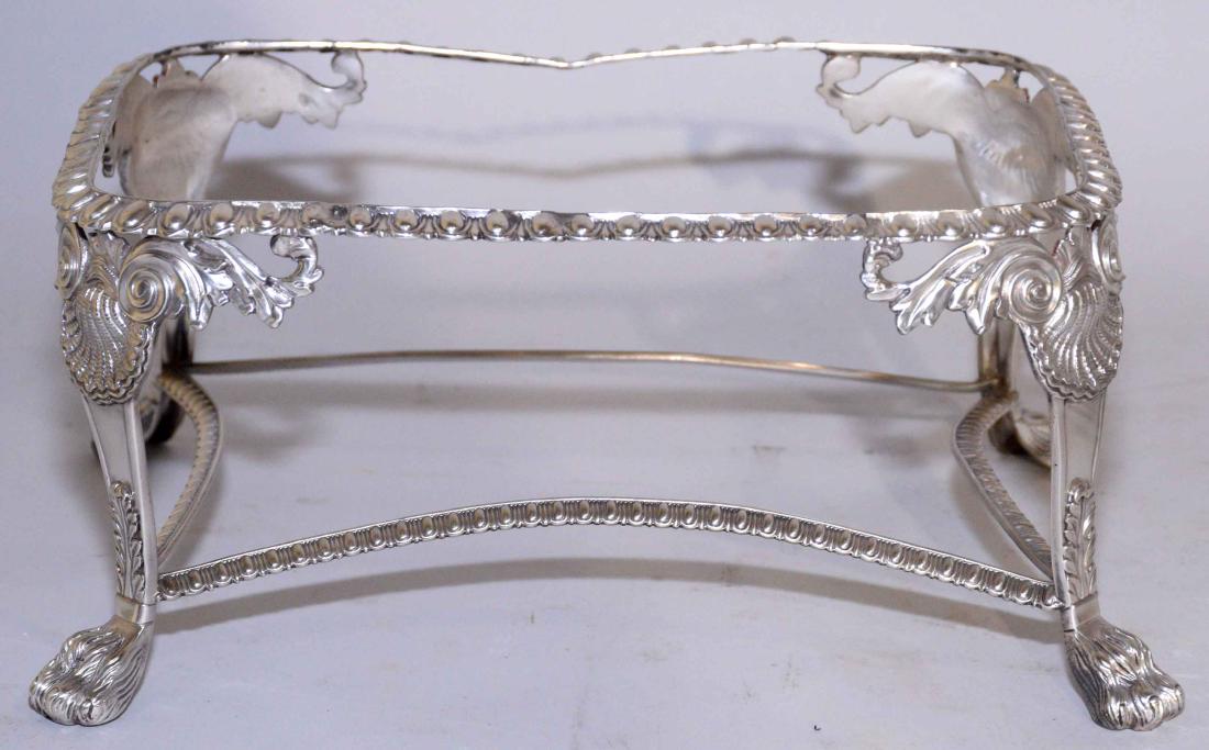 A RECTANGULAR STAND, maker's mark e over e, London,: A RECTANGULAR STAND, maker's mark e over e, London, 1815, with egg-and-dart borders on four shell-capped paw feet, 4 1/2 in. high; 10 1/4 in. long; 7 1/4 in. deep, weight 16 oz. troy (approximately).