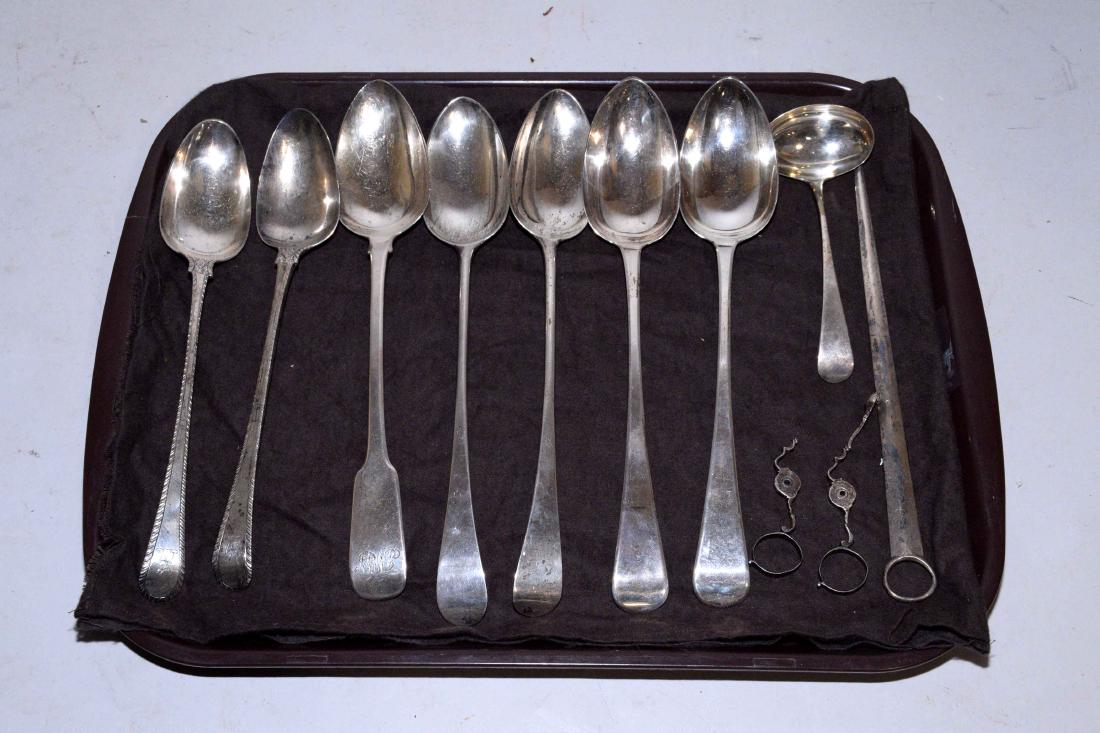 A GROUP OF TEN GEORGIAN AND VICTORIAN STERLING: A GROUP OF TEN GEORGIAN AND VICTORIAN STERLING UTENSILS. Marks of various makers, mid-18th Century and later. Comprising: a pair of serving spoons with feather edge, the terminal engraved with armoria