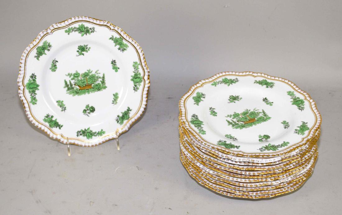 A SET OF TWELVE ENGLISH (COPELAND SPODE) PORCELAIN: A SET OF TWELVE ENGLISH (COPELAND SPODE) PORCELAIN DINNER PLATES. 20th Century. Each with shaped border and printed in green with foliate sprays and gilt highlights centering a basket, the gadrooned r