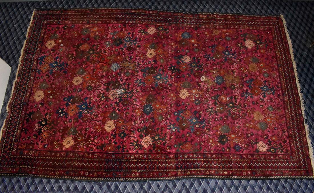 A. TABRIZ CARPET. 20th Century.The rose-colored ground: A. TABRIZ CARPET. 20th Century.The rose-colored ground with an allover repeating rosette and vine design, in light blue, dark blue, rust and ivory, the outer borders incorporating a zig-zag. 6 ft. 3 i