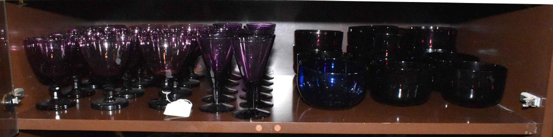 A GROUP OF ASSORTED COLORED GLASS. 20th Century.: A GROUP OF ASSORTED COLORED GLASS. 20th Century. Comprising: a group of violet-colored glass, comprising: six water goblets, 5 in. high (each), ten wine glasses, 5 in. high (each). A group of amethyst