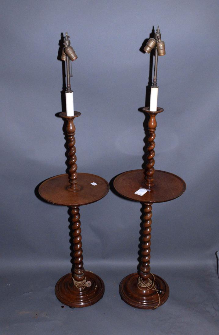 A PAIR OF ENGLISH MAHOGANY BARLEY-TWIST LAMP TABLES.: A PAIR OF ENGLISH MAHOGANY BARLEY-TWIST LAMP TABLES. 20th Century. Each on a ringed-disc foot, the table top with dish edge, 58 in. high (overall, including fitments),