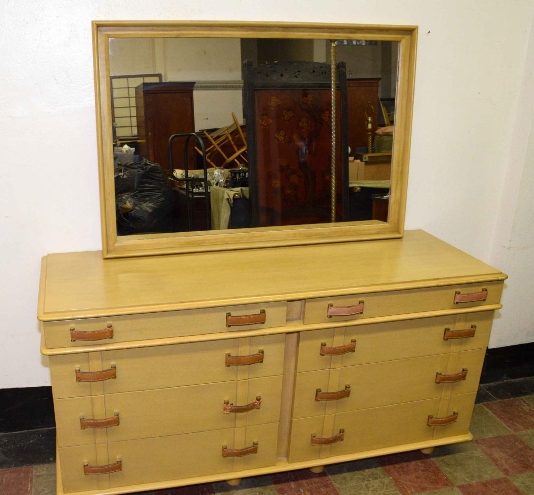 MID-CENTURY PAUL FRANKL ''Station Wagon'' dresser: MID-CENTURY PAUL FRANKL ''Station Wagon'' dresser w/mirror for Johnson Furniture Co. Eight-drawer dresser: 32''H x 66''L x 22.5''D. Mirror: 33.75''H x 50''L x 2.25''D. Condition: one leather pull tape