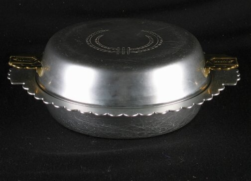 KENSINGTON WARE DORCHESTER DISH. 1935-1936. Art D: KENSINGTON WARE DORCHESTER DISH. 1935-1936. Art Deco aluminum and brass ''Dorchester Double serving Dish'' cat. no. 7381. Designed by Lurelle Guild. Patent filed 11-26-1935, patent issued 1-28-1936. L