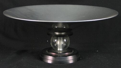 KENSINGTON WARE STRATFORD COMPOTE. c. 1934-35. De: KENSINGTON WARE STRATFORD COMPOTE. c. 1934-35. Designed by Lurelle Guild. Glass ball decoration. Special Order black base and support ring. Marked: stag head, shield and script mark. Size: 13.5'' d. x