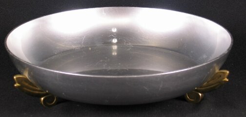 KENSINGTON WARE IMPERIAL BOWL. C. 1936. Art Deco: KENSINGTON WARE IMPERIAL BOWL. C. 1936. Art Deco aluminum and brass ''Imperial fruit bowl'' cat. no. 7428. Designed by Lurelle Guild. Aluminum body with three brass feet. Marked: stag head, shield and