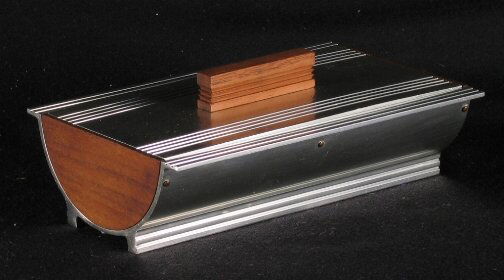 KENSINGTON WARE PENTHOUSE CIGARETTE BOX. 1938-193: KENSINGTON WARE PENTHOUSE CIGARETTE BOX. 1938-1939. Art Deco aluminum and walnut ''Penthouse Cigarette Box'' cat. no. 7542. Designed by Lurelle Guild. Wooden handle and sides, wooden divider. Marked: