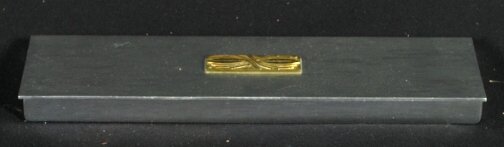 KENSINGTON CAROLINIAN BOX. Art Deco Kensington Wa: KENSINGTON CAROLINIAN BOX. Art Deco Kensington Ware aluminum and brass ''Carolinian Cigarette Box'' cat. no. 7547. Lurelle Guild design, brass decorated top, three section interior. (1935 best seller