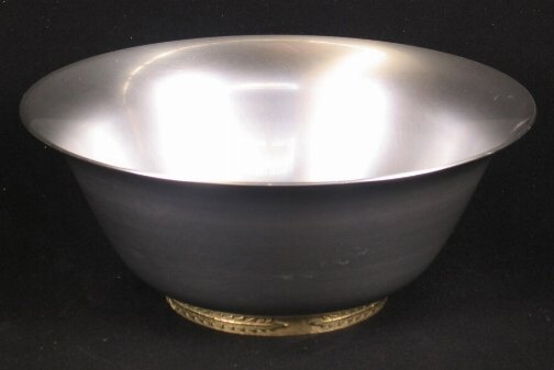 KENSINGTON WARE EPICUREAN BOWL. Art Deco aluminum: KENSINGTON WARE EPICUREAN BOWL. Art Deco aluminum and brass ''Epicurean Salad Bowl'' cat. no. 7259. Designed by Lurelle Guild. Brass ring base. Marked: Stag head, shield and script mark. Size: 4 3/4''