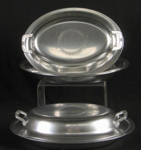 PR KENSIINGTON WINCHESTER DISHES. 1940. Pair of A: PR KENSIINGTON WINCHESTER DISHES. 1940. Pair of Art Deco Kensington Ware aluminum ''Winchester Double Serving Dish'' cat. no. 7382. Designed by Lurelle Guild, patent applied for 2-25-1940, patent issu