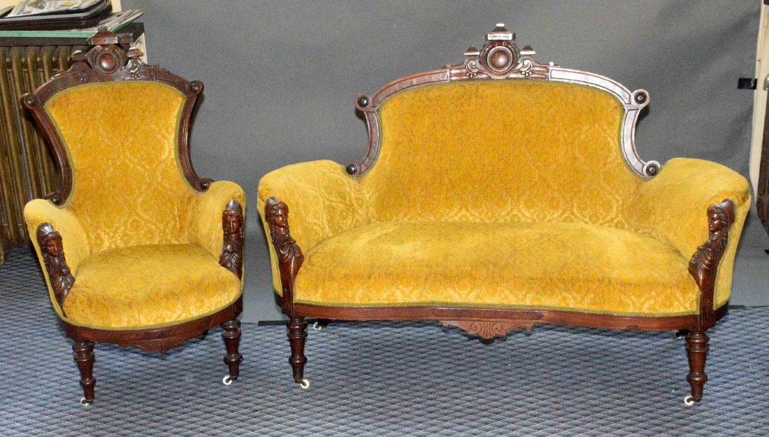 VICTORIAN COUCH AND CHAIR. Carved figural sides. Couch:: VICTORIAN COUCH AND CHAIR. Carved figural sides. Couch: 42''H x 61''W x 32''D. Chair: 44''H x 28''W x 32''D.