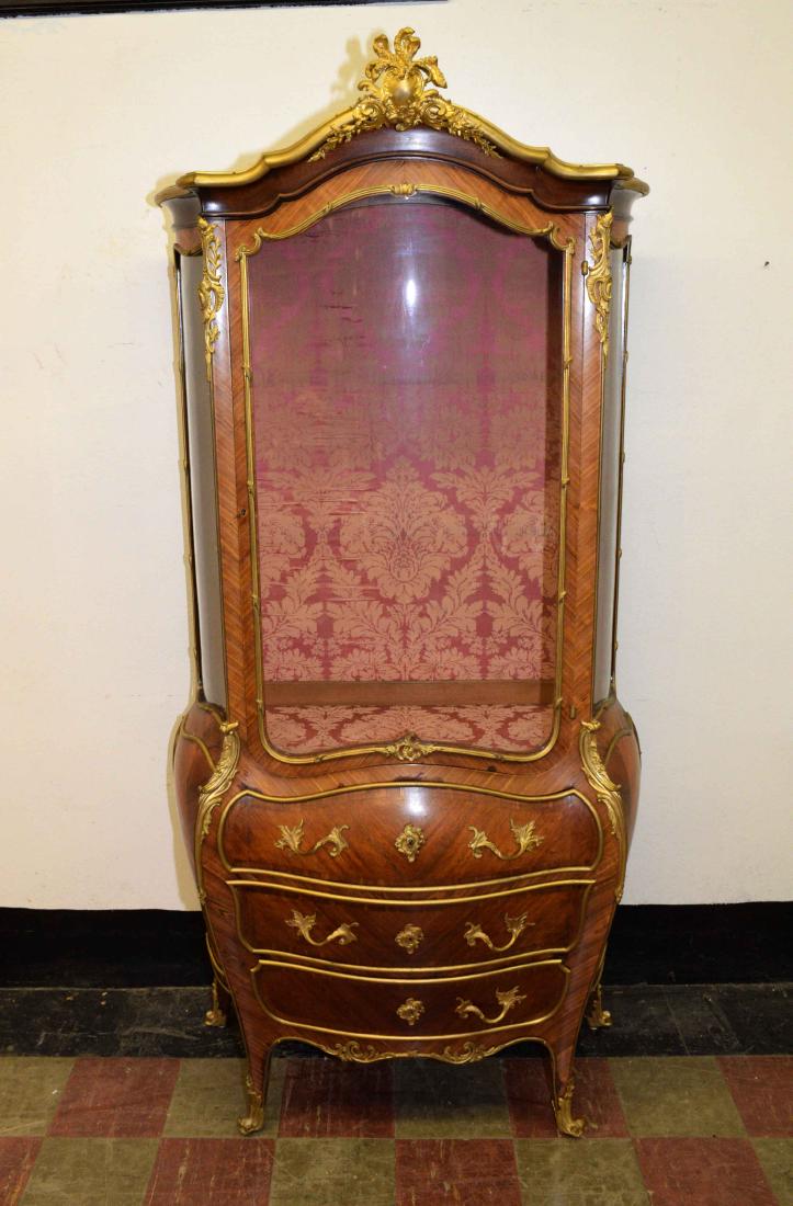 VERY FINE 19TH CENTURY FRENCH ORMOLU BOMBE VITRINE,: VERY FINE 19TH CENTURY FRENCH ORMOLU BOMBE VITRINE, with gilt mounts and three serpentine glass panels, two glass shelves and three drawers underneath. In the style of Linke but no signature was found