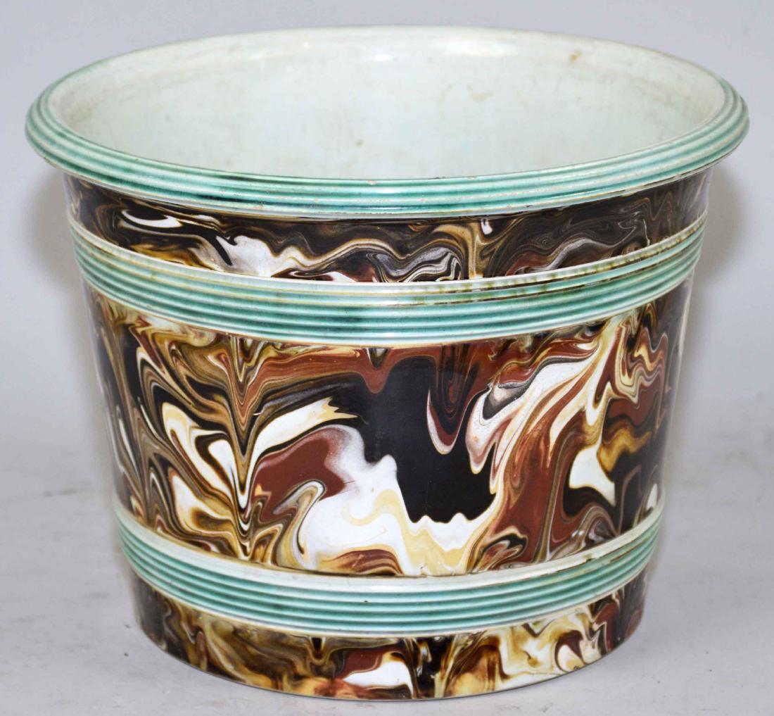 AN ENGLISH (STAFFORDSHIRE) PEARLWARE JARDINIERE.: AN ENGLISH (STAFFORDSHIRE) PEARLWARE JARDINIERE. 19th/20th Century. With agate sides and green reeded borders. 7 in. high; 9 in. diameter. Center drilled.