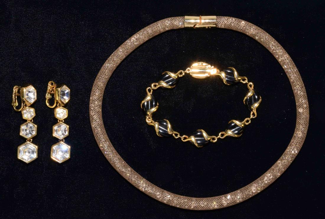 (3) ASST. PIECES OF SIGNED SWAROVSKI CRYSTAL GOLDTONE: (3) ASST. PIECES OF SIGNED SWAROVSKI CRYSTAL GOLDTONE JEWELRY. Includes a mesh choker, bracelet and a pair of clip earrings.
