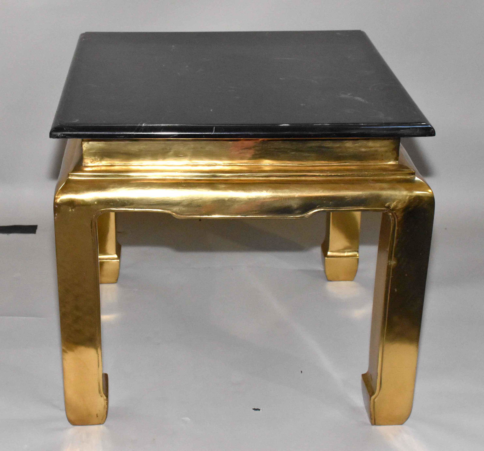 BRASS AND GRANITE END TABLE. 21.25''H x 22.5''W x: BRASS AND GRANITE END TABLE. 21.25''H x 22.5''W x 22.5''D.