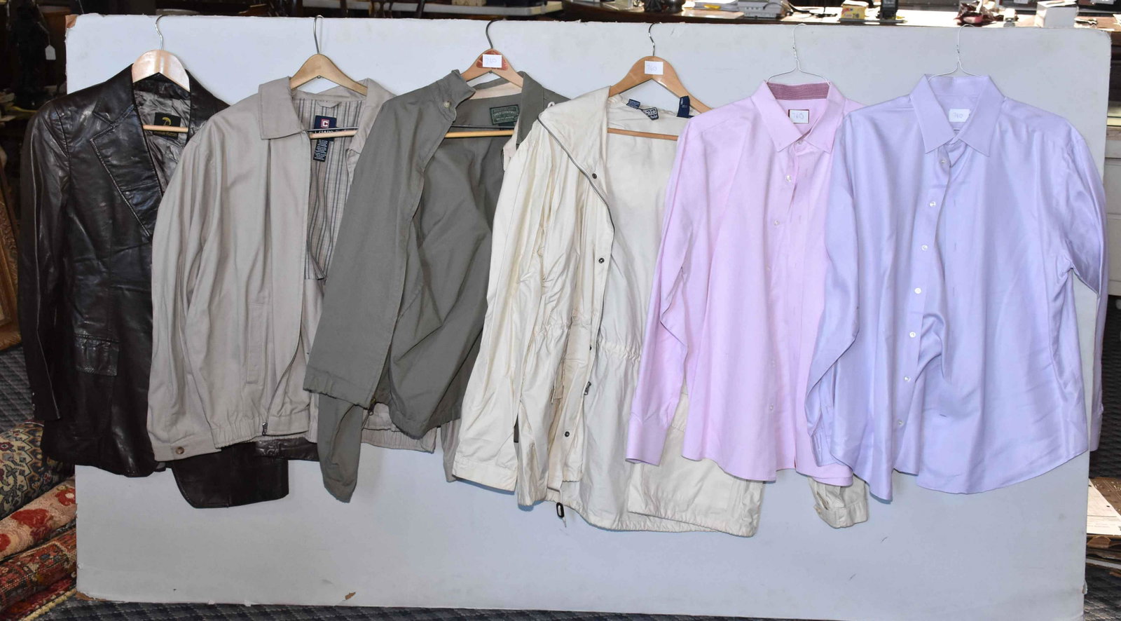 GROUP OF CLOTHING (6 pieces), including shirts (Untuck: GROUP OF CLOTHING (6 pieces), including shirts (Untuck It XL and Giorgio Armani XL), Neiman Marcus XL leather coat, Polo raincoat and jacket - both XL) and Chaps jacket XL. Estate of Stephen Totter.