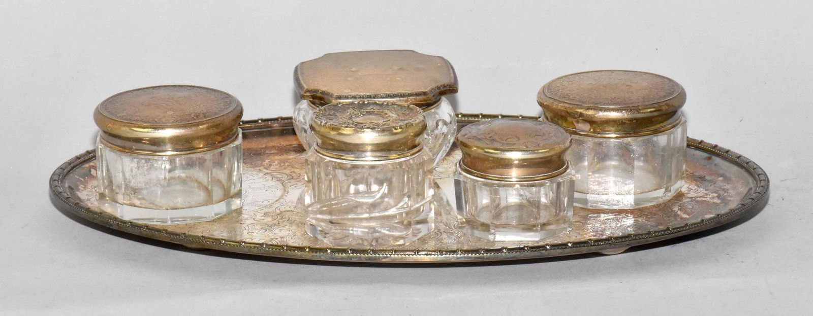 (6) PC. ANTIQUE DRESSER SET. With 10'' oval Barker: (6) PC. ANTIQUE DRESSER SET. With 10'' oval Barker Ellis silverplate tray: (5) sterling lid and crystal trinket boxes. All marked sterling. Total weight 2.0 ozt. Estate of Stephen Totter.