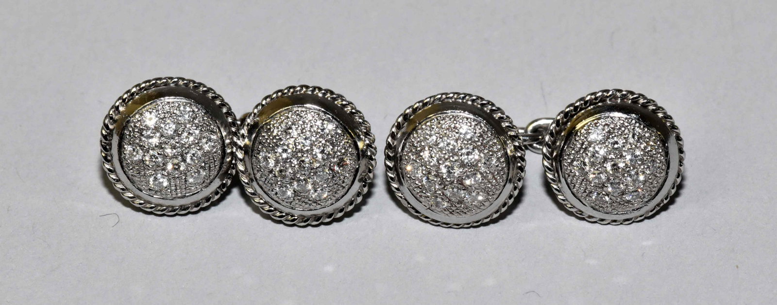 DIAMOND AND PLATINUM CUFFLINKS. PT 950, total weight: DIAMOND AND PLATINUM CUFFLINKS. PT 950, total weight 8.9 dwt. Estate of Stephen Totter.