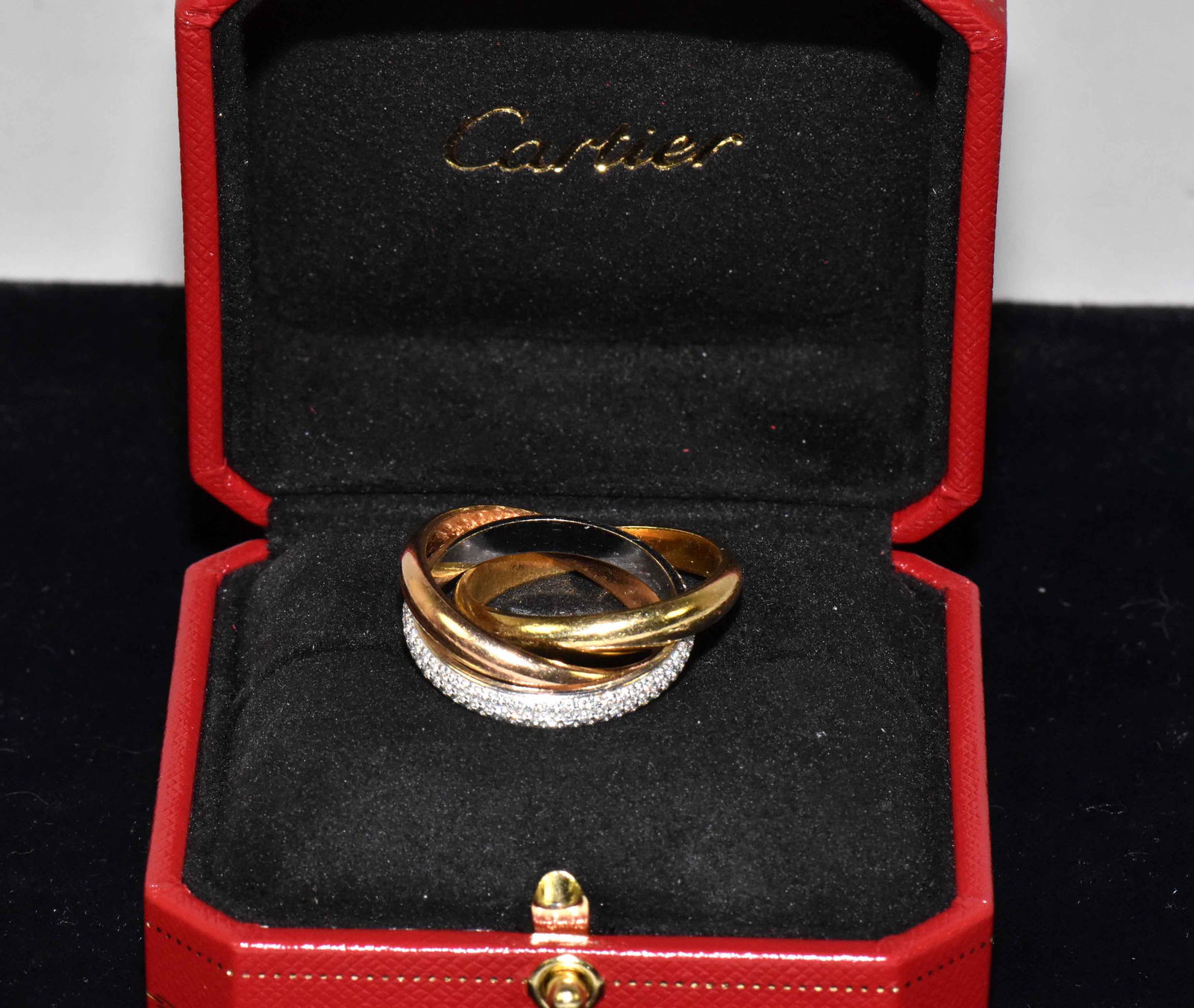 CARTIER TRINITY PAVE DIAMOND RING, 18K tricolor gold,: CARTIER TRINITY PAVE DIAMOND RING, 18K tricolor gold, signed ''Cartier 750 64@ PX 1997''. It is crafted from 18K yellow, white and rose gold with a highly polished finish from Cartier's Trinity Collec