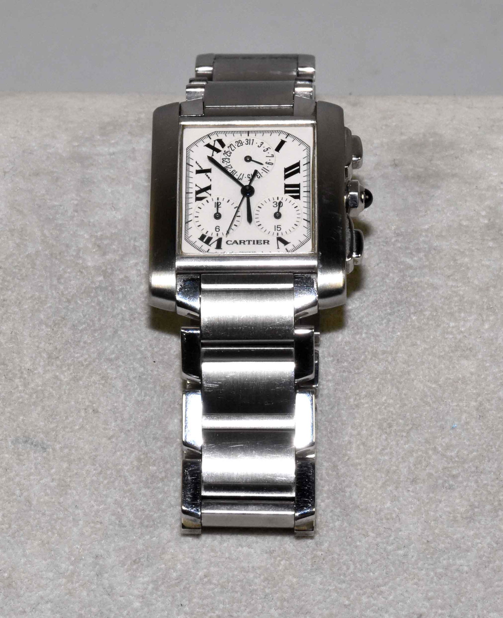 CARTIER TANK FRANCAISE CHRONOGRAPH IN STAINLESS STEEL.: CARTIER TANK FRANCAISE CHRONOGRAPH IN STAINLESS STEEL. Model 2303. Octagonal crown set with a blue cabochon sapphire, stamped on back, Cartier, water resistant, stainless steel, 2303. Swiss made. Esta
