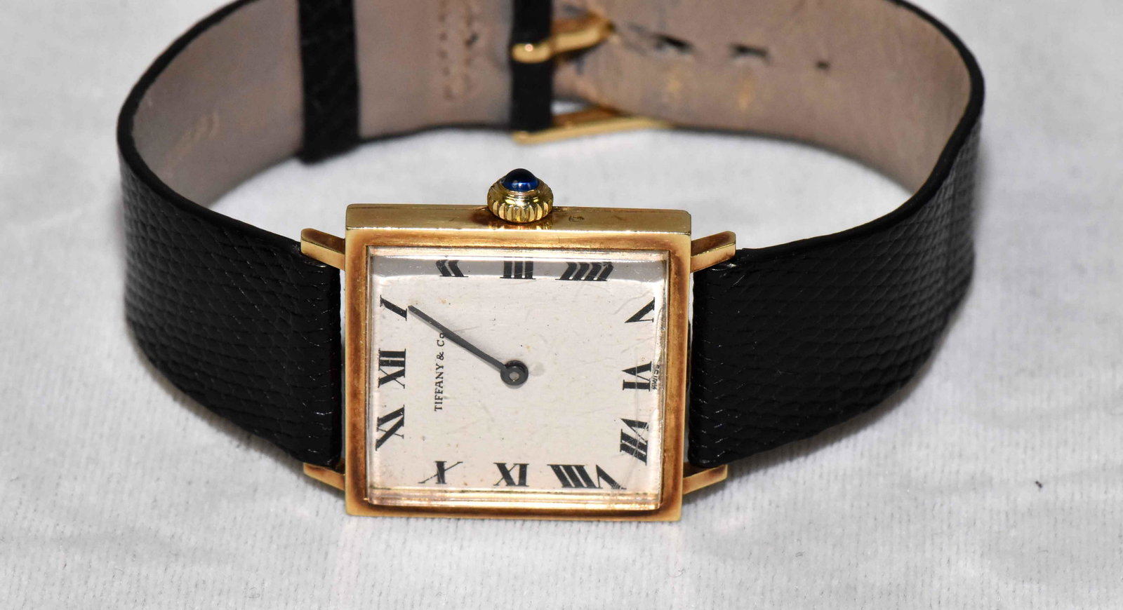 CLASSIC TIFFANY & CO. WATCH. Swiss made. Crown set with: CLASSIC TIFFANY & CO. WATCH. Swiss made. Crown set with blue sapphire cabochon. Estate of Stephen Totter.