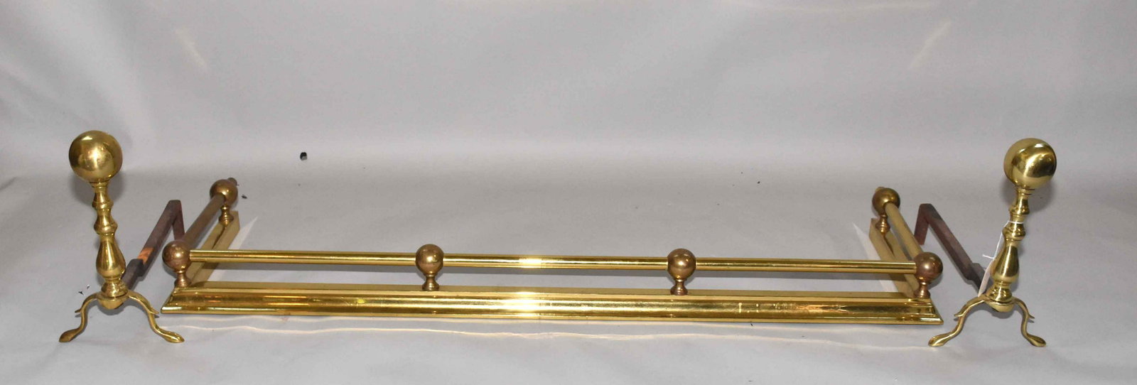 BRONZE FENDER AND ANDIRONS. Fender length: 51.75''L.: BRONZE FENDER AND ANDIRONS. Fender length: 51.75''L.