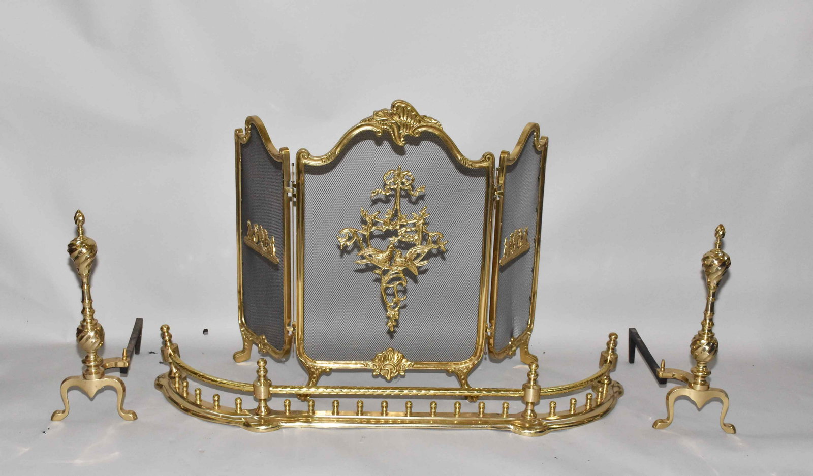 ORNATE BRONZE FIREPLACE FENDER, SCREEN AND ANDIRONS.: ORNATE BRONZE FIREPLACE FENDER, SCREEN AND ANDIRONS. Fender length: 47.5''L.