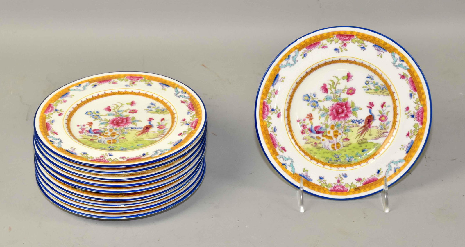 (10) ANTIQUE COALPORT CHINA DESSERT PLATES, in white,: (10) ANTIQUE COALPORT CHINA DESSERT PLATES, in white, blue and yellow band w/peacocks. Green stamp 5654/T A.D. 1750. 7.5'' diameter. Estate of Stephen Totter.