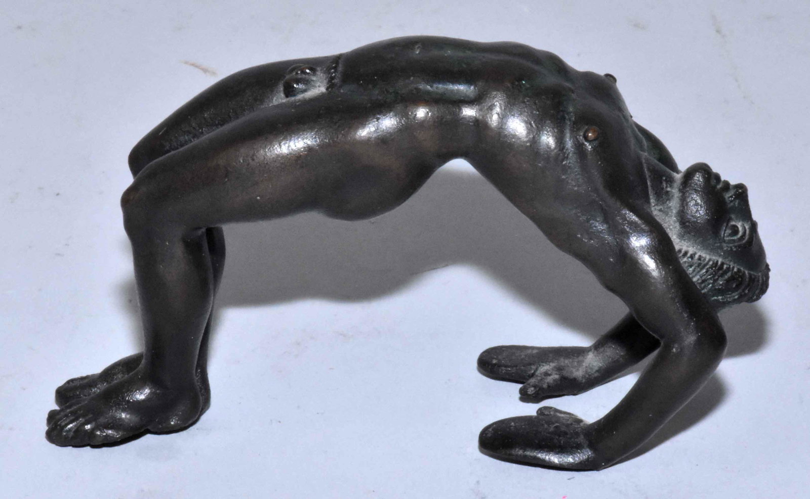 BRONZE SCULPTURE OF MAN, signed MMA. 2.5''H x 4.5''L.: BRONZE SCULPTURE OF MAN, signed MMA. 2.5''H x 4.5''L. Estate of Stephen Totter.