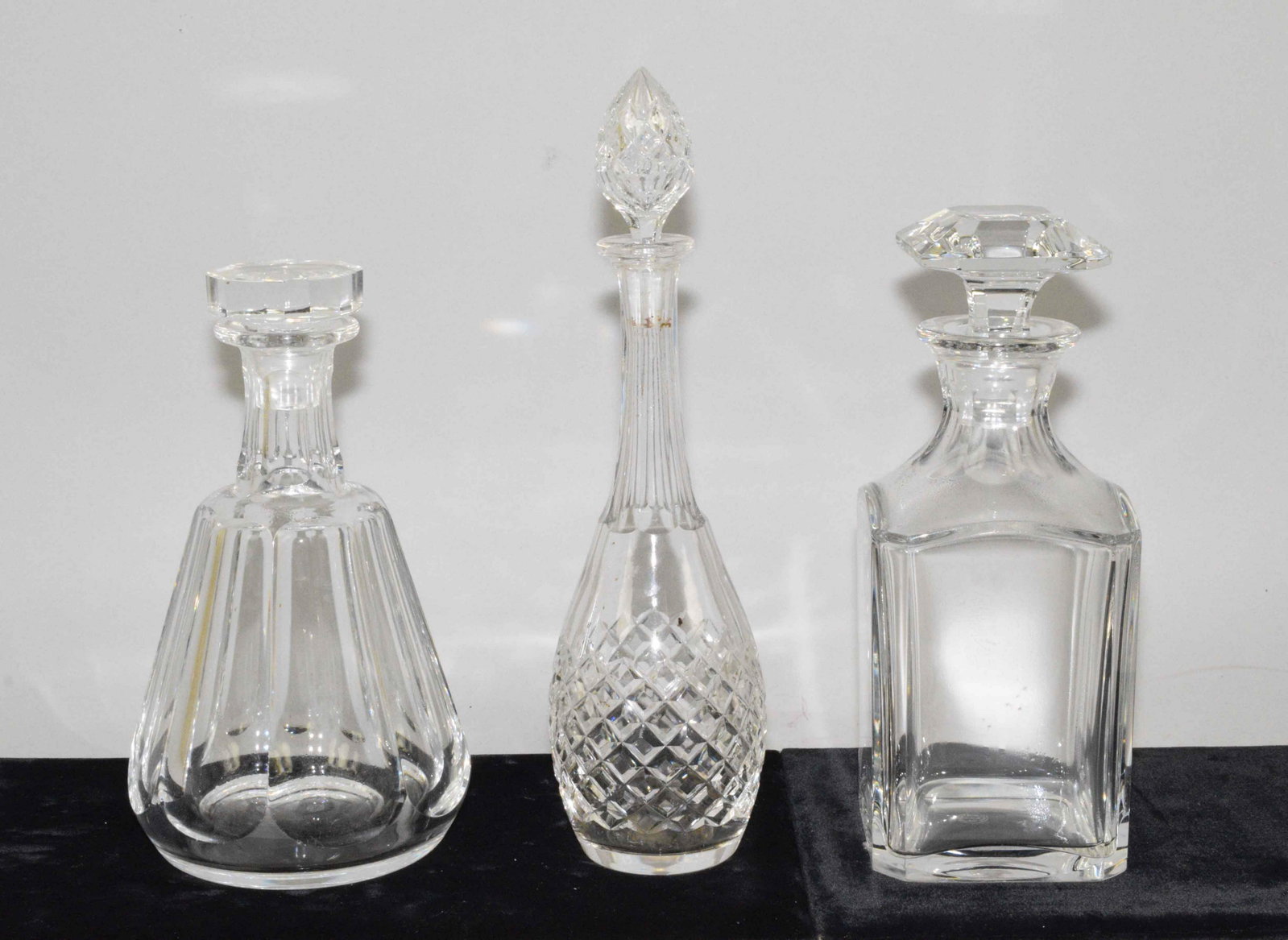 (3) BACCARAT FRENCH CRYSTAL DECANTERS. Largest:: (3) BACCARAT FRENCH CRYSTAL DECANTERS. Largest: 12.25''H. Estate of Stephen Totter. Condition: stopper has chip.