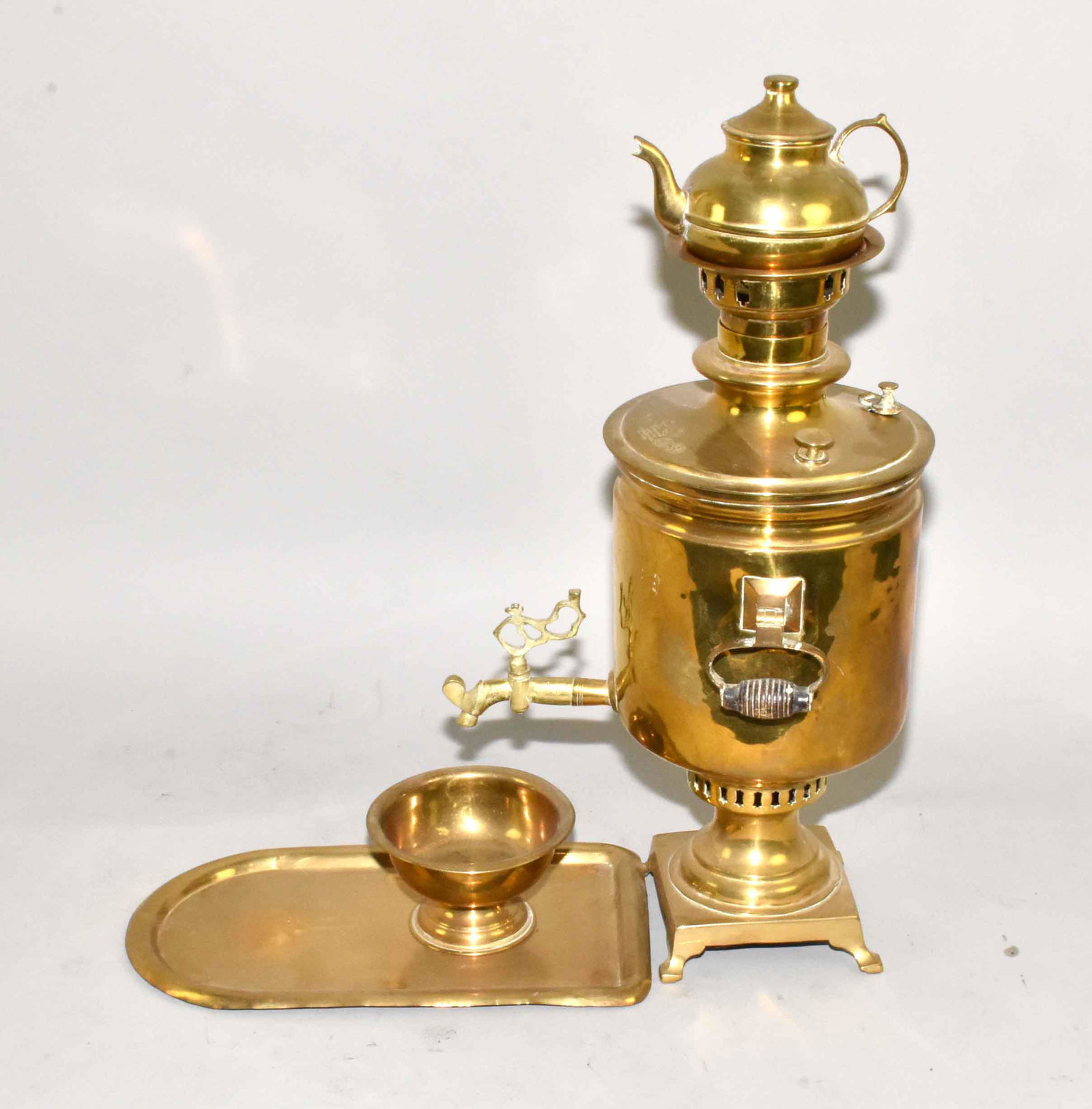ANTIQUE BRASS SAMOVAR WITH TEAPOT, bowl and tray.: ANTIQUE BRASS SAMOVAR WITH TEAPOT, bowl and tray. 22''H. Estate of Stephen Totter.