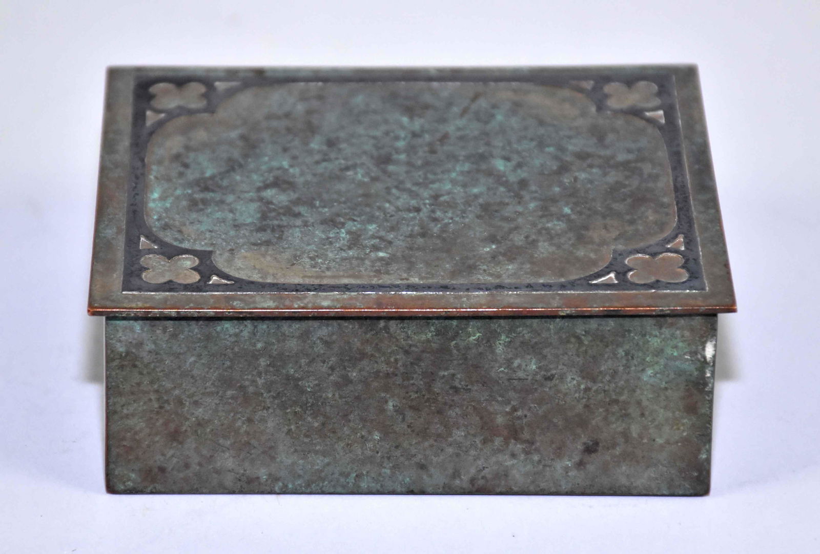 ARTS AND CRAFTS SILVERCREST DECORATIVE BRONZE BOX: ARTS AND CRAFTS SILVERCREST DECORATIVE BRONZE BOX w/sterling overlay. With wood interior, 508-L. 1.5''H x 4.25''W. Estate of Stephen Totter.