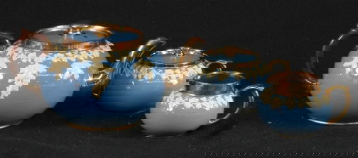 3 PC GIBSON TEA SET: 3 PC GIBSON TEA SET. Three piece Gibson ceramic tea set, exterior blue and white ''Wedgwood Style'' decoration, blue body, white grape vine frieze, rims, handles and spout gilt lustre finish, interior