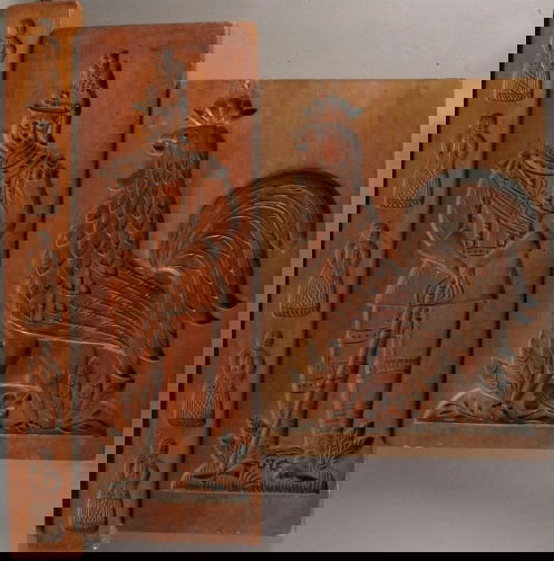 3 EUROPEAN WOODEN COOKIE MOLDS: 3 EUROPEAN WOODEN COOKIE MOLDS. Three wooden carved cookie molds. (1) Tall panel with five separate women figures with ring hanger. Size: 3 1/4''W, 24 1/2''H, 1''D. (1) Reversable mold with man in uni