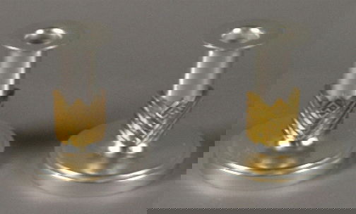 PR VANITY FAIR CANDLE HOLDERS: PR VANITY FAIR CANDLE HOLDERS. Pair of Art Deco aluminum and brass Kensington Ware Vanity Fair candle holders, cat. no. 7400. Designed by Lurelle Guild, patent filed 4-20-1935, issued 12-10-1935. Earl