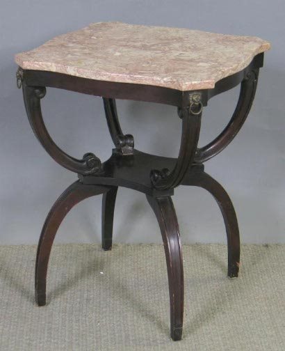 1940'S MARBLE TOP END TABLE: 1940'S MARBLE TOP OCCASIONAL TABLE. Serpentine reddish brown marble top on curule form base. Has lions heads with rings in their mouths mounted to the apron corners. Size: 28'' H, 22'' W, 22'' D. Cond