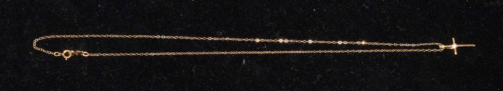 14K GOLD CROSS PENDANT W/SMALL CENTER STONE on a 14K: 14K GOLD CROSS PENDANT W/SMALL CENTER STONE on a 14K gold chain. Mark BG14K. Length 15.5''. 0.3 dwt.