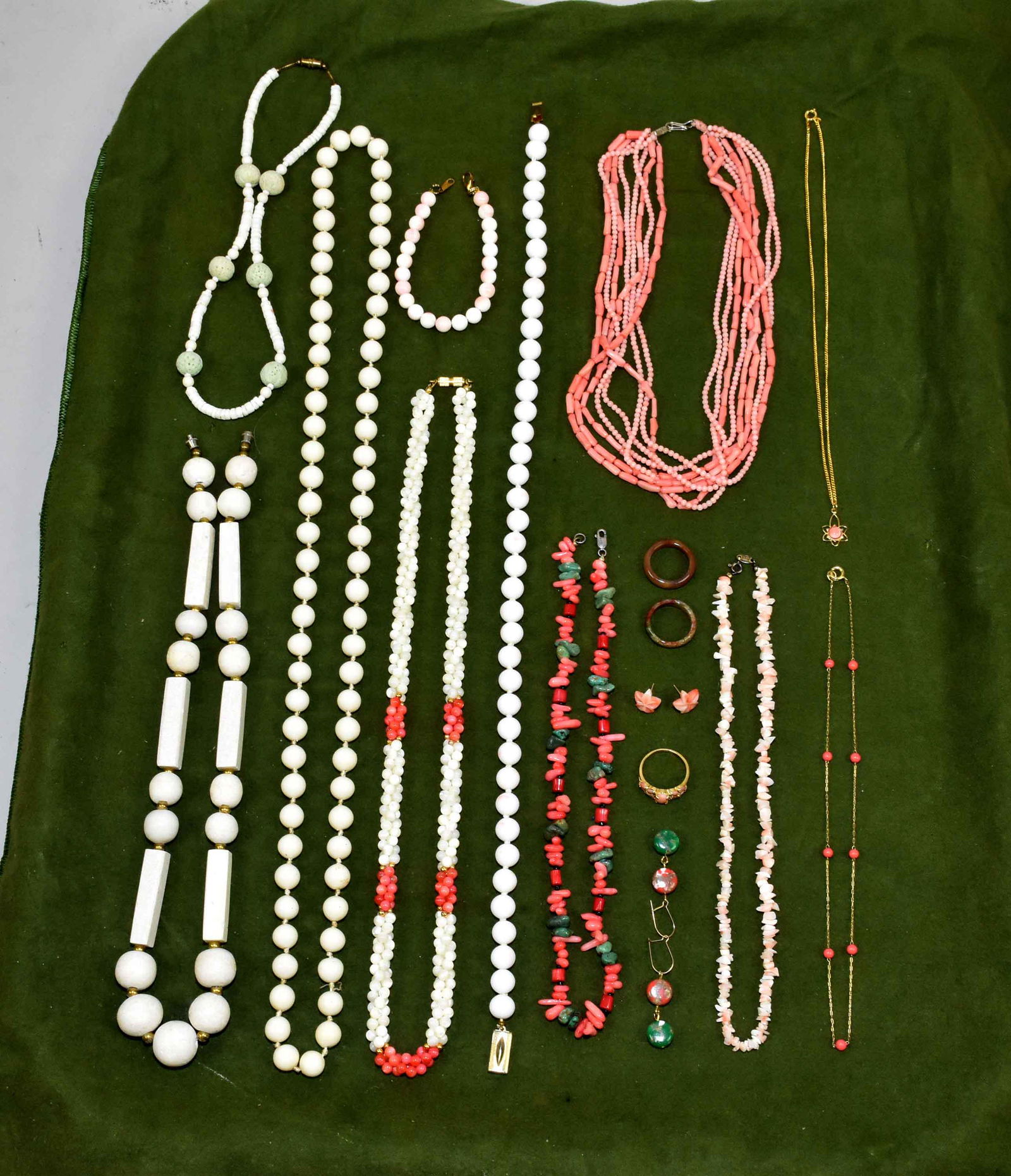 (15) PC. MISC. CORAL COSTUME JEWELRY LOT. To include:: (15) PC. MISC. CORAL COSTUME JEWELRY LOT. To include: Peach, Angel Skin and white tone beaded, multi-strand and gold tone chain necklaces, one bracelet. With 14 kg filled ring and (2) pairs of earring