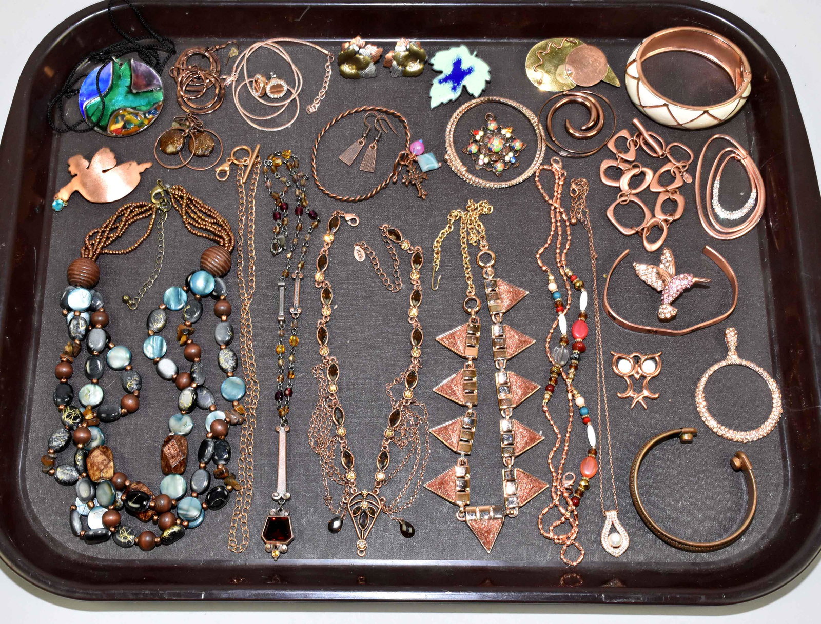 (25+) MISC. COPPER COSTUME JEWELRY LOT. Variety: (25+) MISC. COPPER COSTUME JEWELRY LOT. Variety includes beaded, rhinestone enamel and solid necklaces, bracelets, pins and earrings.