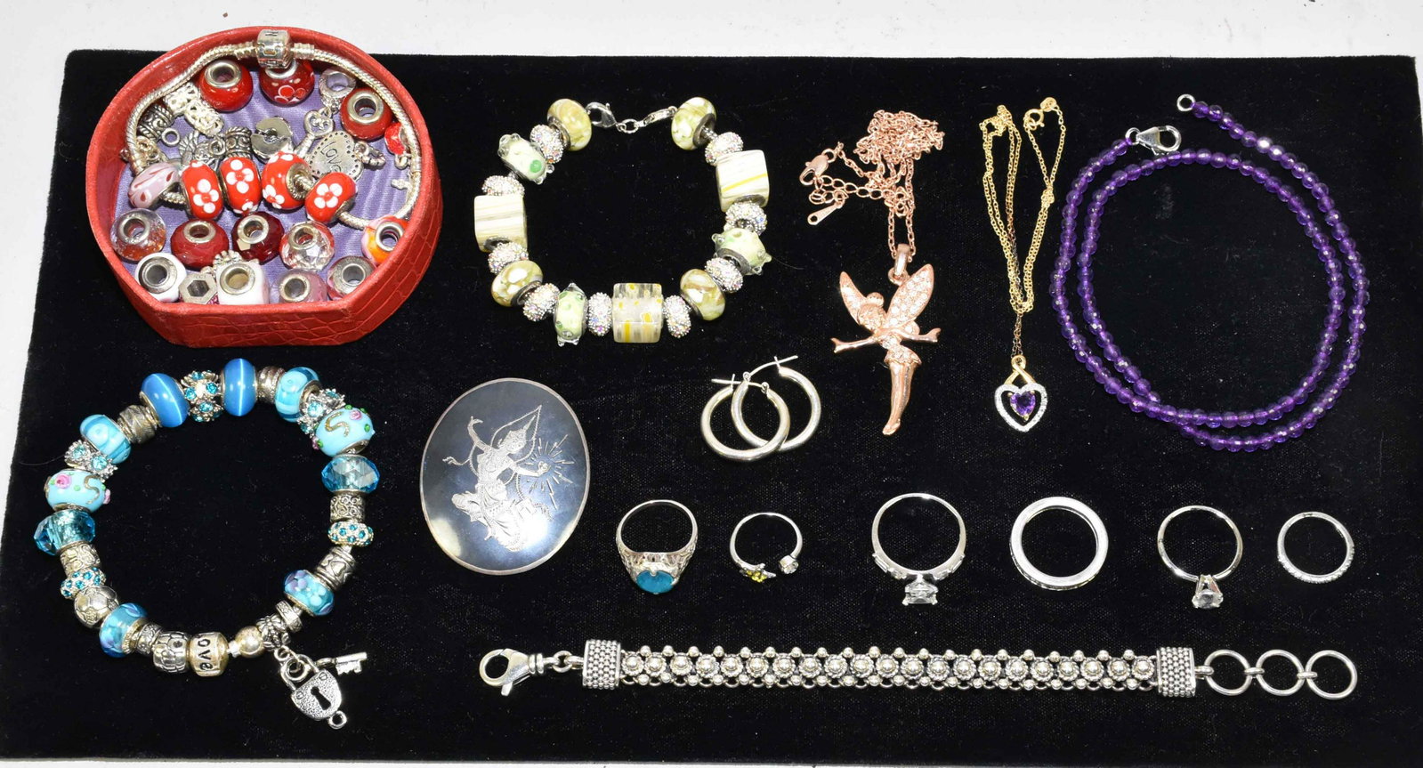 LOT OF MISC. STERLING JEWELRY. (2.9 ozt.) To include:: LOT OF MISC. STERLING JEWELRY. (2.9 ozt.) To include: (4) bracelets; (1) 8'' signed 925 ball and chain link. (1) ''LOVE'' 925 snake chain; w/two other in silvertone, included w/various charms - 23 in 